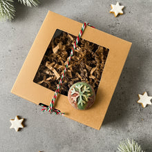 Load image into Gallery viewer, Eco kraft box tied with festive cord featuring round soap with snowflake motif.