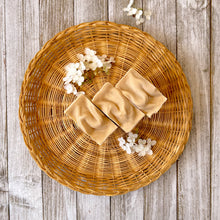 Load image into Gallery viewer, The off-white soap bar has a textured top.