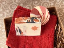 Load image into Gallery viewer, Canadian Christmas Self Care Gift Box featuring a red towel, Cranberry Yogurt & Maple Leaf soap bars by Woods and Mosses.