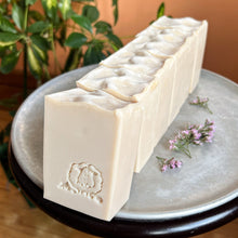 Charger l'image dans la galerie, Creamy off-white artisan soap bars with a smooth, slightly textured top edge. Each bar is embossed with a hand-stamped lamb design, adding a rustic charm. The soap has a natural, minimalist appearance, reflecting its gentle, skin-friendly ingredients.