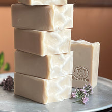 Charger l'image dans la galerie, Creamy off-white artisan soap bars with a smooth, slightly textured top edge. Each bar is embossed with a hand-stamped lamb design, adding a rustic charm. The soap has a natural, minimalist appearance, reflecting its gentle, skin-friendly ingredients.
