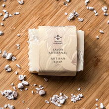 Load image into Gallery viewer, A white marbled soap bar wrapped in a beige label with the Woods and Mosses logo and the words Savon Artisanal and Artisan Soap printed on the front.