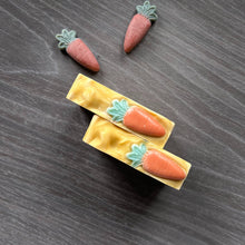 Load image into Gallery viewer, The soap top is deep yellow, textured, with a small orange-green carrot decoration. Carrot Soap - Woods and Mosses