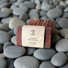 Load image into Gallery viewer, Menβs natural artisan soap bar in a deep mocha shade, wrapped in an eco-friendly label reading βSavon Artisanal β Artisan Soapβ by Woods & Mosses. Handmade soap with smooth marbled texture, designed for refined menβs skincare routines.