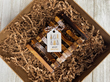 Load image into Gallery viewer, Canadian Christmas Self Care Gift Box featuring a wooden soap dish & Merry Christmas tag.