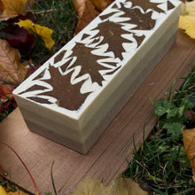 Load image into Gallery viewer, Uncut soap loaf featuring oak leaf embedded design on top. Artisan-made with botanical oils and herbal colorants. Perfect for gifting or slicing into individual bars for autumn-themed natural skincare.