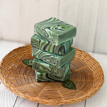 Load image into Gallery viewer, Five herbal sage soap bars positioned upright showing thin sides with artistic swirl detailing, emphasizing the unique cut of each handmade bar.