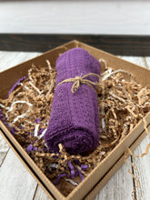 Load image into Gallery viewer, Rolled purple cotton washcloth tied with jute twine, nestled in shredded kraft paper inside men’s spa gift box.