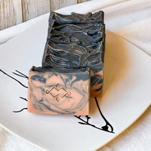 Load image into Gallery viewer, Detailed view of artisan soap with striking color contrasts, highlighting high-quality, natural materials.