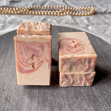 Load image into Gallery viewer, Handcrafted swirl soap with silk and jojoba oil, artisan stamped, pink and cream tones on a grey tray. Artisan soap by Woods & Mosses.