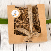 Load image into Gallery viewer, Eco-friendly kraft gift box with shredded paper filling and a jute bow, perfect for packaging handmade soaps.