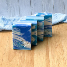 Load image into Gallery viewer, Detailed Ocean Wave soap bar with deep sea-inspired swirls, placed with a linen background for a soft contrast.