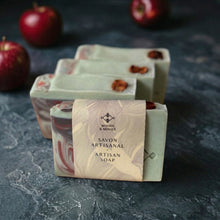 Load image into Gallery viewer, Apple shea butter artisan soap with paper band, showing one wrapped bar and three matching bars behind.