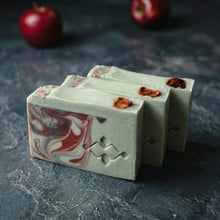 Load image into Gallery viewer, Three apple shea butter artisan soap bars with creamy green tops and red marbled fronts.