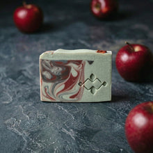 Load image into Gallery viewer, Single apple shea butter artisan soap bar with creamy green top, red marbling, Woods and Mosses geometric stamp.