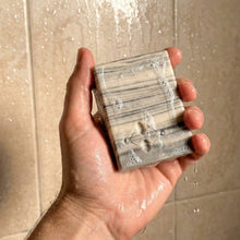 Load image into Gallery viewer, Handmade Birch Design soap bar with creamy lather, gray and ivory birchwood stripes, embossed Woods &amp; Mosses logo.