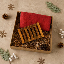 Load image into Gallery viewer, Red cotton face cloth and slatted wooden soap dish arranged with paper filler in a kraft Christmas gift box.