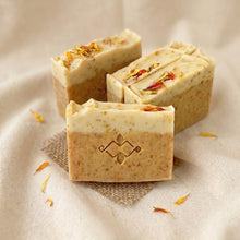 Load image into Gallery viewer, Calendula turmeric organic soap bars with cream swirled tops and dried calendula petals