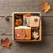 Load image into Gallery viewer, Open fall soap gift set with maple leaf and spiced pumpkin bars, mini leaves, and kraft packaging on rustic wood