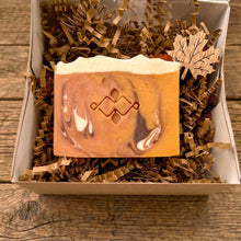 Load image into Gallery viewer, Spiced pumpkin handmade soap bar with orange, cream, and brown swirls in a kraft gift box