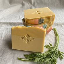 Load image into Gallery viewer, Creamy handmade carrot soap bars with stamped front bar and carrot embeds