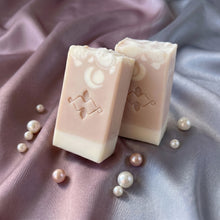 Load image into Gallery viewer, Two collagen shea butter soap bars standing upright, one angled in front and one behind.