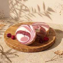 Load image into Gallery viewer, Two round Cranberry Yogurt soap bars with pink swirls and small cranberry accents