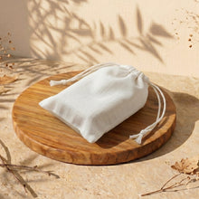Load image into Gallery viewer, Cranberry Yogurt soap packaged in a plain white cotton pouch, bar hidden inside