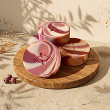 Load image into Gallery viewer, Three round Cranberry Yogurt soap bars with pink, cream, and burgundy swirls