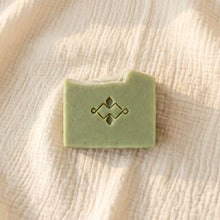 Load image into Gallery viewer, Single pale green frankincense and orange soap bar on beige fabric