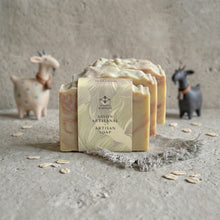 Charger l'image dans la galerie, Three handmade goat milk and oatmeal soap bars, one wrapped with Woods and Mosses branded paper band.