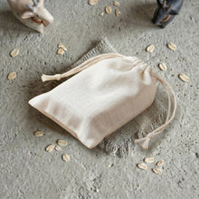 Charger l'image dans la galerie, Goat milk and oatmeal soap bar packaged in a soft cotton drawstring gift bag.