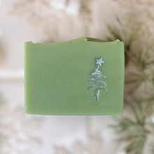 Load image into Gallery viewer, A pale green square soap with a handpainted silver Christmas tree. The bar has a wavy top.