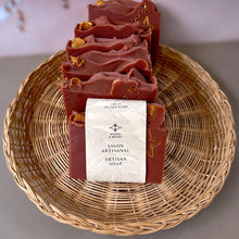 Load image into Gallery viewer, The soap bar is labeled and wrapped with recyclable paper for an eco-friendly touch. The label features the Woods and Mosses company logo and the words Artisan Soap in both French and English.