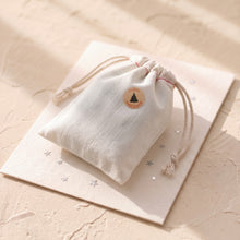 Load image into Gallery viewer, Handmade Christmas soap packaged in a white cotton gift bag with a round Happy Holidays sticker.