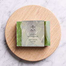 Charger l'image dans la galerie, Wrapped green handmade soap bar with visible lace edges and Woods &amp; Mosses label