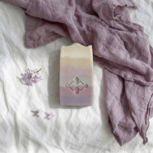 Load image into Gallery viewer, Single tall lilac soap bar with cream top, mauve base, pastel layers and stamped logo