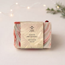 Charger l'image dans la galerie, Christmas soap bar wrapped in a Woods &amp; Mosses paper sleeve, with red and pale green marbling visible at the sides.