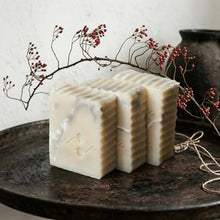 Load image into Gallery viewer, Three white marbled soap bars on a dark surface with decorative branches and berries in the background - Woods and Mosses