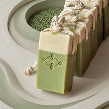 Load image into Gallery viewer, Five matcha latte soap on a rope bars lined up, showing green sides, cream tops, and hanging cords.