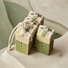 Load image into Gallery viewer, Four matcha latte soap on a rope bars grouped together, highlighting the creamy top swirl and green body.