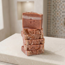 Load image into Gallery viewer, Stack of Moroccan clay soap bars with marbled terracotta layers and stamped top bar