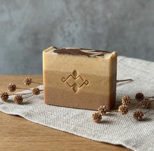Load image into Gallery viewer, Single handmade Moroccan Rhassoul clay soap bar with soft beige layers and centered Woods and Mosses logo stamp.