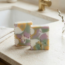 Load image into Gallery viewer, Two upright pastel swirl soap bars with marbled pink, green, yellow and white pattern.