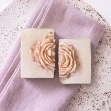Load image into Gallery viewer, Two handmade peony soaps with raised blush floral designs on creamy square bars