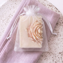 Load image into Gallery viewer, Peony flower soap bar with ivory base and blush sculpted bloom, gift-ready style in organza bag
