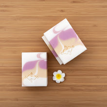Load image into Gallery viewer, Two soap bars with a floral design and Woods and Mosses stamped logo on a wooden surface.