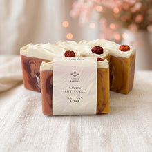 Load image into Gallery viewer, Pumpkin artisan soap bars with orange marbling, cream tops, mini pumpkin embeds, and paper sleeve packaging