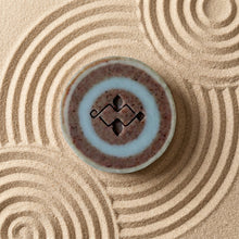 Load image into Gallery viewer, Single River Stone round soap bar, top view, with soft blue ring and speckled blueberry center - Woods and Mosses