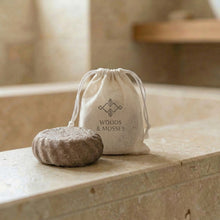 Load image into Gallery viewer, Rosemary mint men's shampoo bar beside a cotton drawstring bag with Woods and Mosses stamped logo.